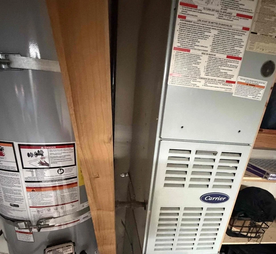 Original gas furnace and water heater in the Everett garage