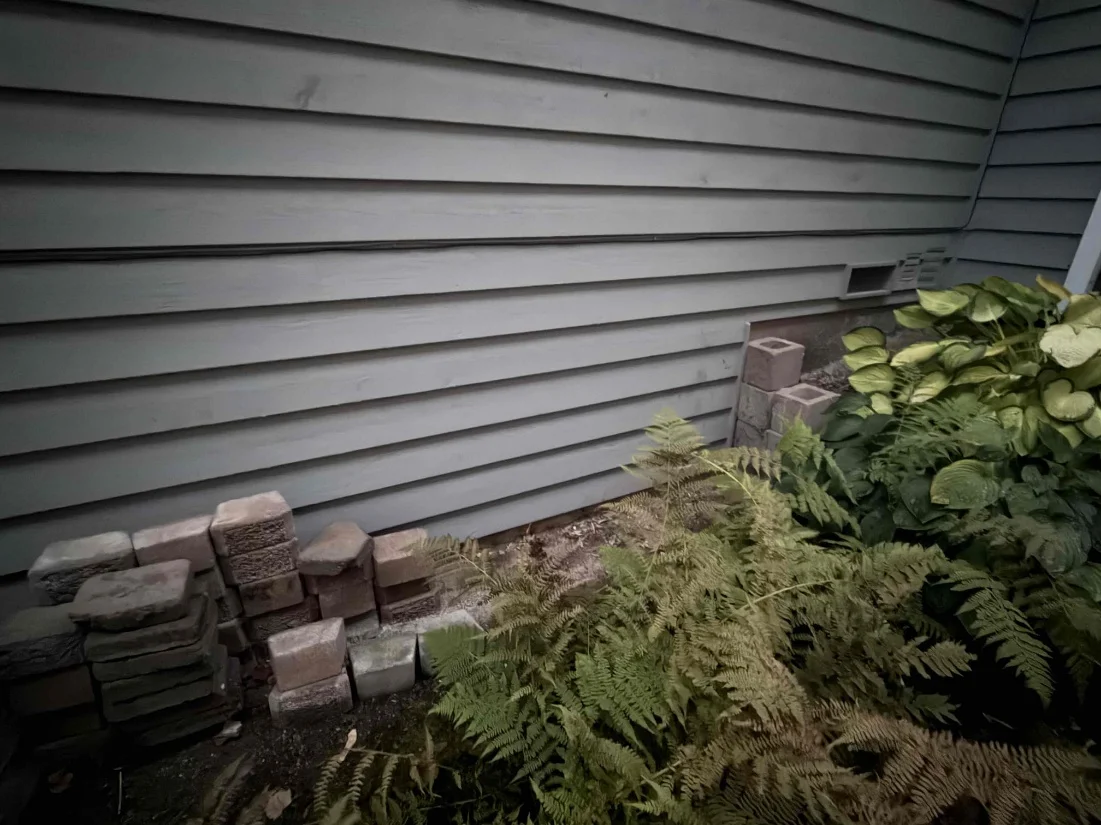 Exterior wall before the heat pump installation in Everett