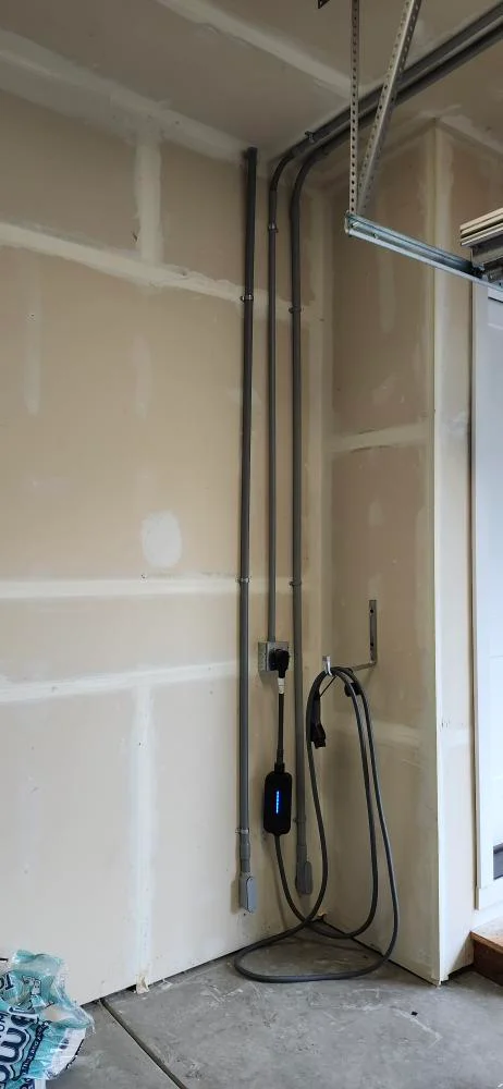 Electrical conduit and wiring inside the Lake Forest Park home during the heat pump circuit project