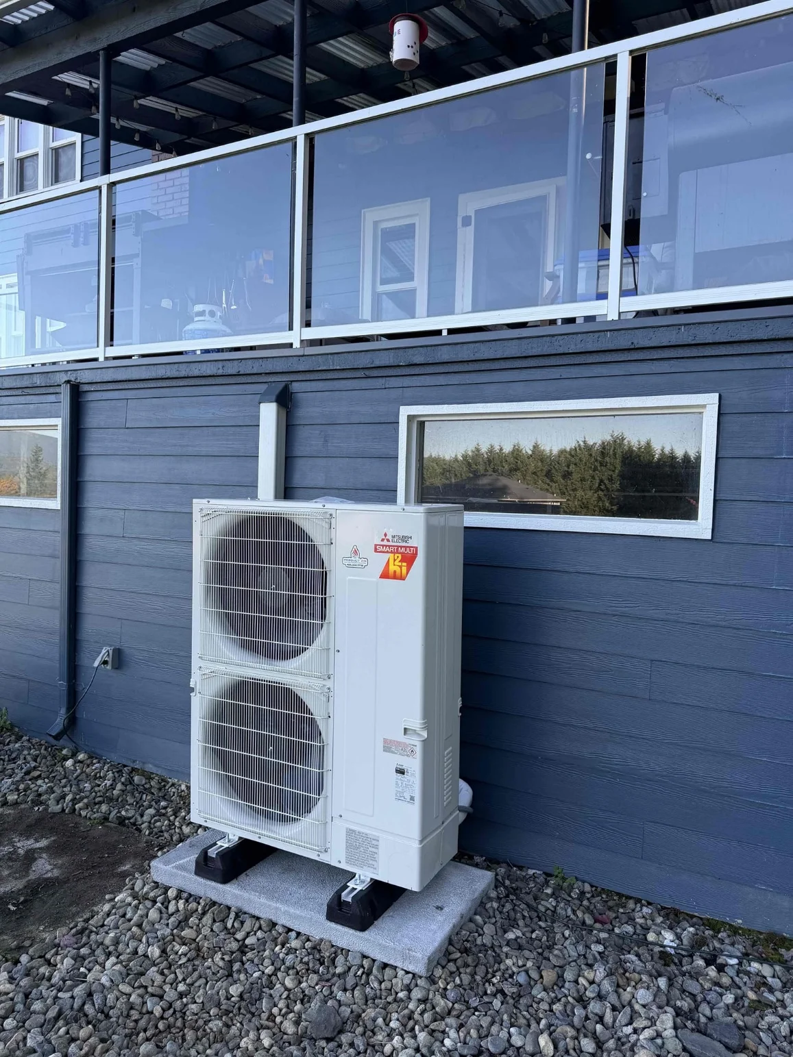 New Mitsubishi multi-zone outdoor heat pump in Arlington