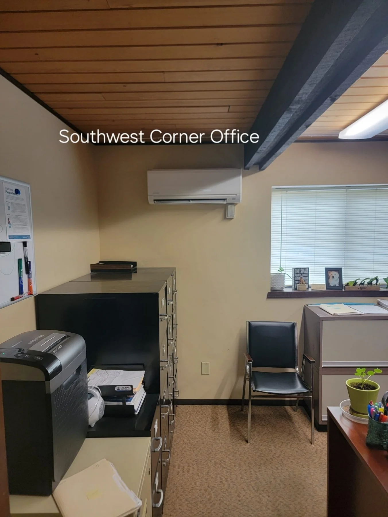 Wall-mounted Mitsubishi ductless mini-split in a southwest corner office in Woodinville, WA