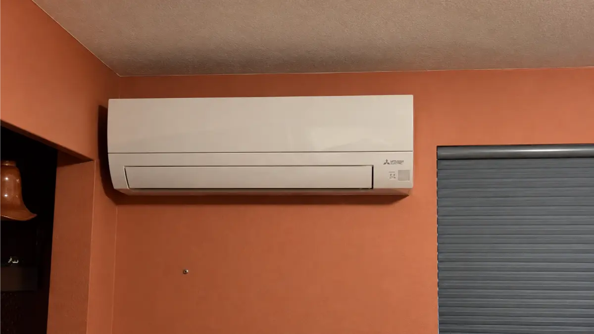 Mitsubishi Electric wall-mounted mini-split indoor unit installed in a residential room.