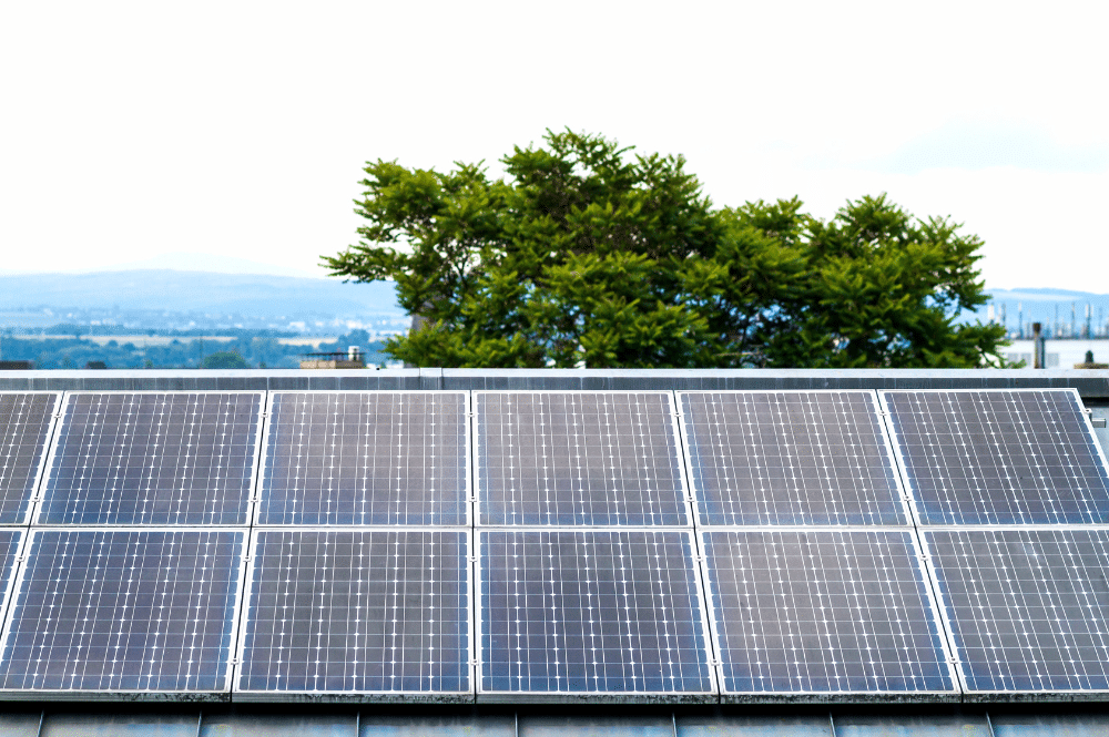 Solar panels installed on a roof, showcasing energy-efficient electrical systems for sustainable energy use.